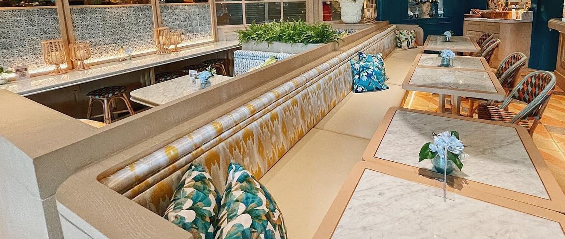 monsieur_spoon_cafe_seating_area_image_patterned_benches_marble_tables_decorative_pillows_upholstery_csl_leather_durango_fpz_5124.jpg.jpg